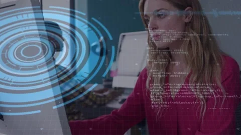 Female developer typing and scrolling at desk, causing blue HUD and code growing Stock Footage 330936176