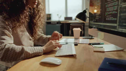 Female Developer Typing Code on Computer at Desk in Office Stock Footage 305317678