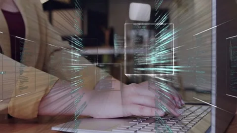 Female developer typing on keyboard, initiating code overlays sweeping across Stock Footage 335466142