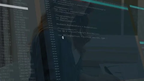 Female developer typing on keys at desk causing fading code overlay expanding Stock Footage 333317863
