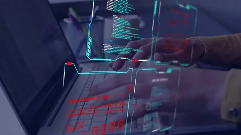 Female developer typing on laptop, initiating HUD updating code panels while 動画素材 333803130