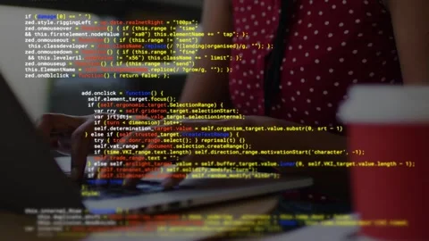 Female developer typing on laptop keys after code overlay appearing, debugging Stockbeeldmateriaal 335761621