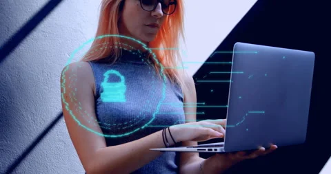 Female developer wearing glasses typing on laptop in tech lab, showcasing Video stock 309103563