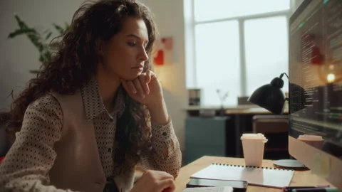 Female Developer Working on Computer and Analyzing Code at Office Desk Stock Footage 305318559