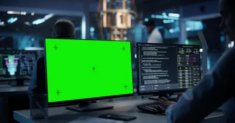 Female Developer Working on Computer with Green Screen Stock Footage 318967041