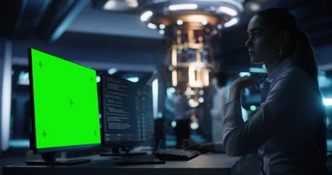 Female Developer Working on Computer with Green Screen Stock Footage 318967079