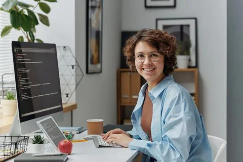 Female developer working on computer at office Foto stock