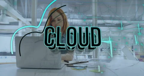 Female developer working at office desk, displaying neon-blue cloud overlay with Stock Footage 309144883
