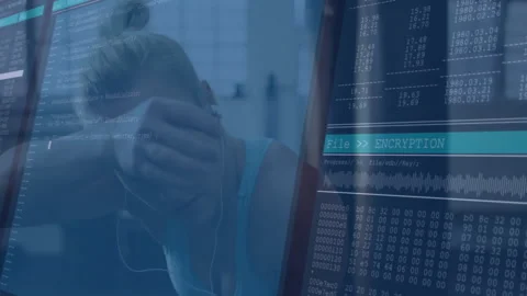 Female developer working in tech, viewing transparent screen overlaying code and Stock Footage 309320874