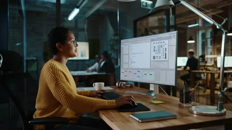 Female Developer Works on Computer in Creative Office Stock Footage 143744791