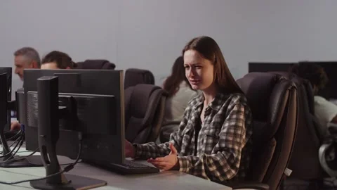 A female developer's computer freezes while working. A view of a perplexed Stock Footage 235974648