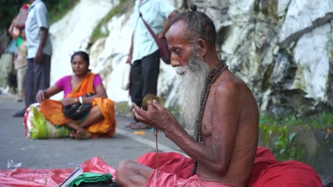 Female devotee playing bell outside Kamakhya Temple Guwahati 4K file 169 Stock Footage 339269352