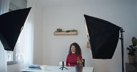 Female digital content creator recording herself on video Stock Footage 146401460
