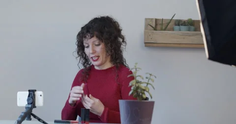 Female digital content creator recording herself on video for her followers Stock Footage 146401989