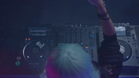 Female dj dancing while playing music at the nightclub Stock Footage 87157231
