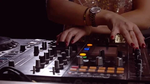 Female DJ hands turning knobs - dj console close up Stock Footage 139977815