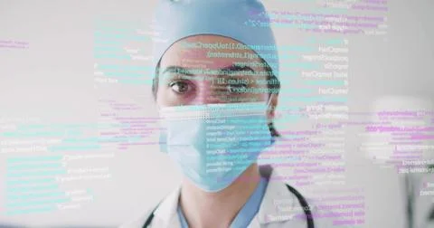 Female doctor analyzing floating code overlay in clinic, with stethoscope, me Stock Photos