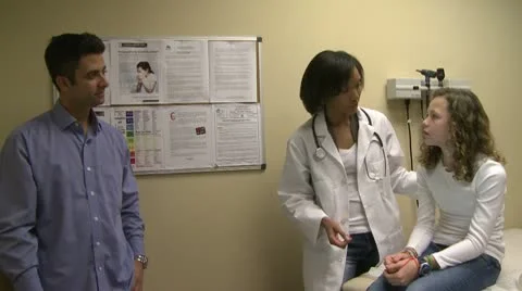 Female doctor in exam room with father a... | Stock Video | Pond5
