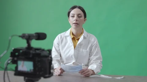 Female doctor explaining how to use a surgical mask Stock Footage 128815880
