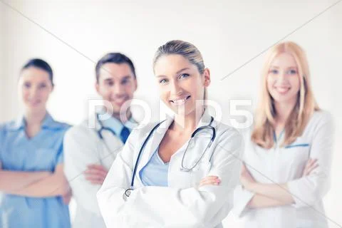 Female Doctor In Front Of Medical Group