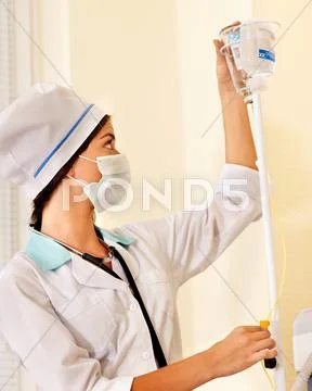 Female doctor with iv drip. Stock Photos