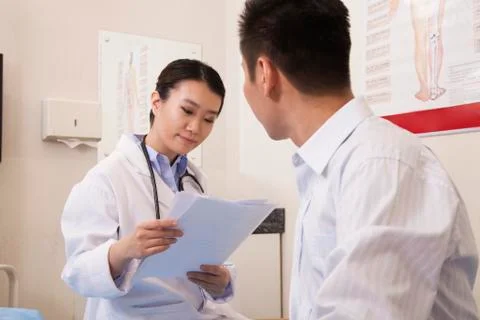 Female Doctor With Male Patient Stock Photos