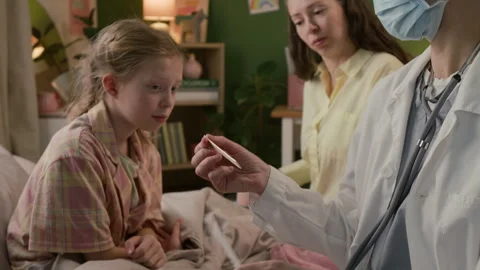 Female Doctor Opening Package, Using Spatula to Examine Throat of Gen Alpha Girl Stock Footage 335471260