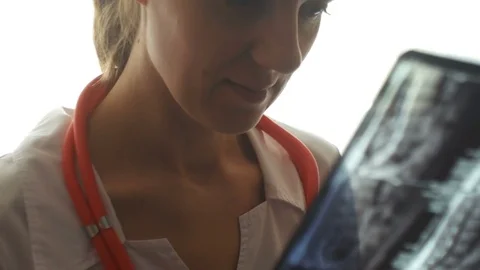 Female doctor reviewing x-ray Stock Footage