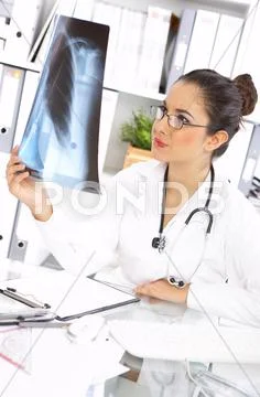 Female doctor in surgery Stock Photos