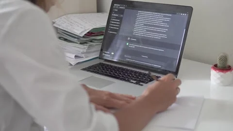 A female doctor uses the artificial intelligence chat GPT to prescribe treatment Stock Footage 240997682