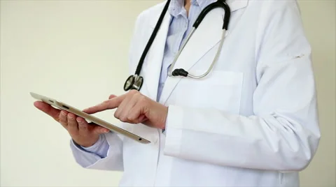 Female doctor using digital tablet in medical clinic Stock Footage 53881200