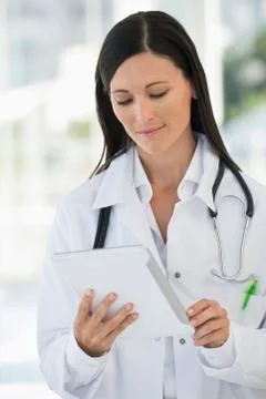 Female doctor using a digital tablet Stock Photos