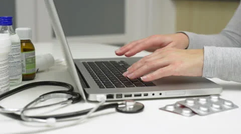 Female doctor using laptop. Stock Footage