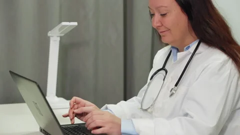 Female doctor using laptop while working in hospital 動画素材 263280562