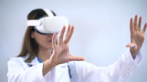 Female doctor using virtual reality headset on white background. Stock Footage 287943988