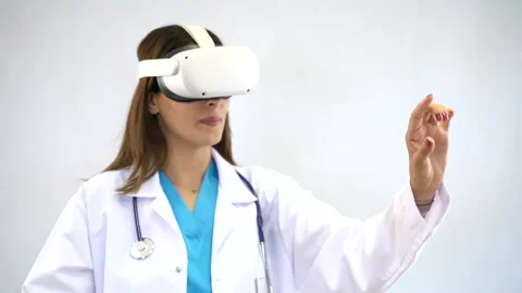 Female doctor using virtual reality headset on white background Stock Footage 287946549
