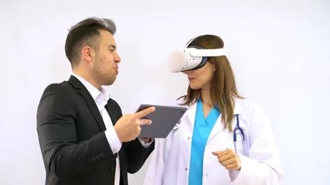 Female doctor using virtual reality headset on white coat is using to examine Stock Footage 287947291