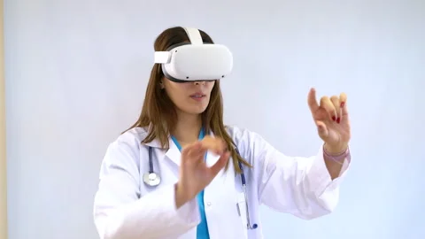 Female doctor using virtual reality headset on white background. Stock Footage 287948894