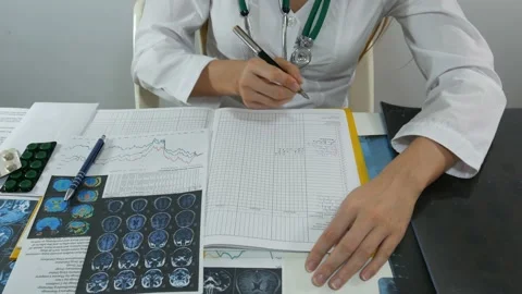 Female doctor working at table Video stock 87795965