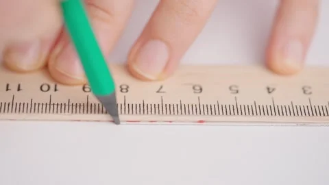 Female draws correct answer in geometry exam test paper with pencil and ruler Stock Footage 280171152