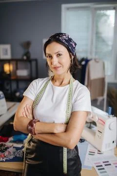 Female a dressmaker posing at a workshop Stock Photos