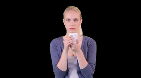 Female drinking a cup of tea Stock Footage 8945131