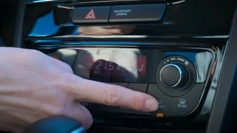Female driver by air conditioning button inside. Stock Footage 288902353