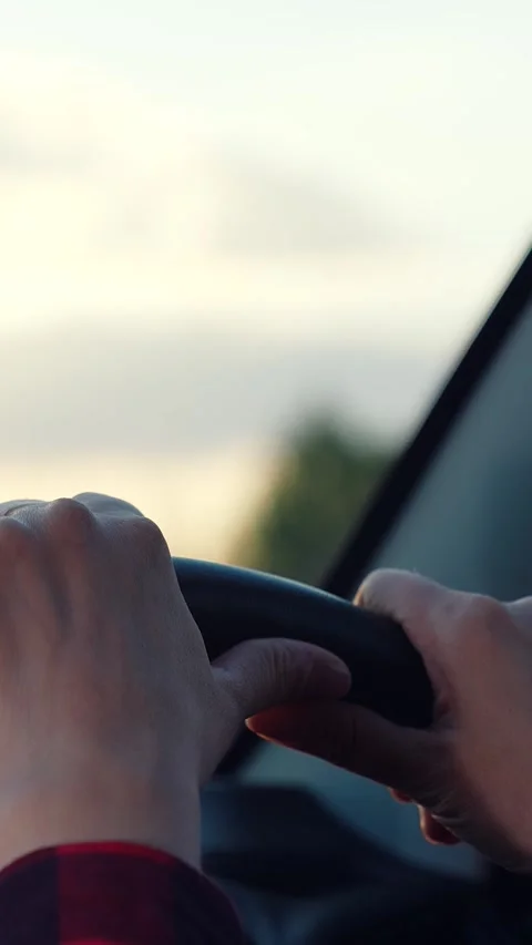 Female driver, road trip, steering wheel, driving adventure, sunlight flare Stock Footage 294667791