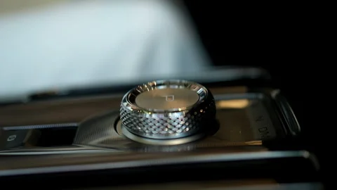 Female driver showcasing sleek interior of new car with focus on automatic gear Video stock 284214628