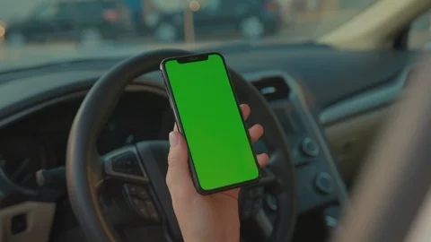Female driver sitting in the car browsing online map on vertical mock-up Stock Footage 117558668