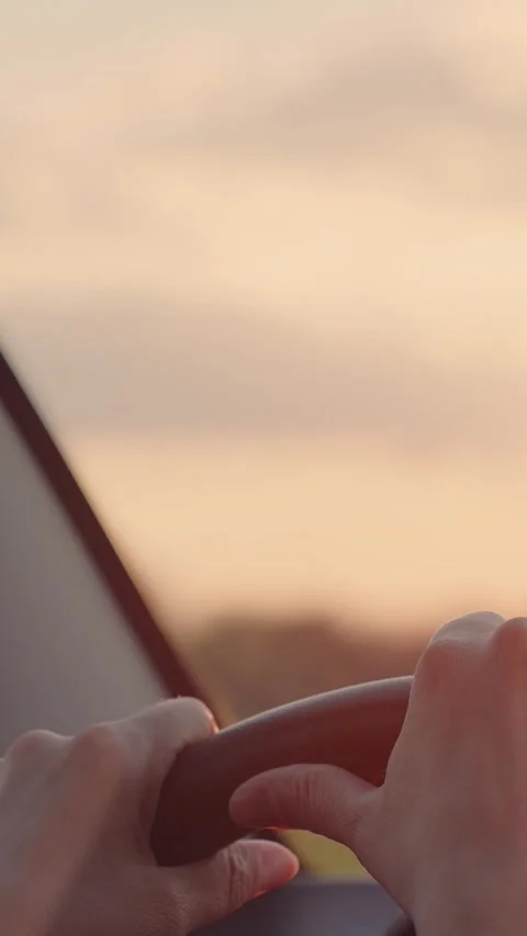 Female driver, steering wheel grip, road trip, sun flare hand, journey driving Stock Footage 296706784