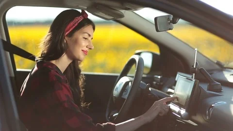 Female driver using gps navigation on trip pc Stock Footage 77921710