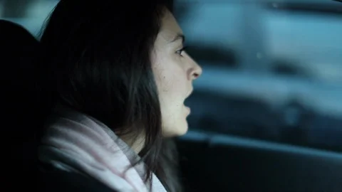 Female driver yawning while driving. Tired sleepy close-up woman face yawns Stock Footage 129039870