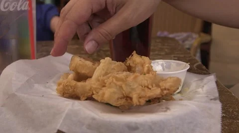 Female eats onion rings and drinks beer 스톡 동영상 50360050